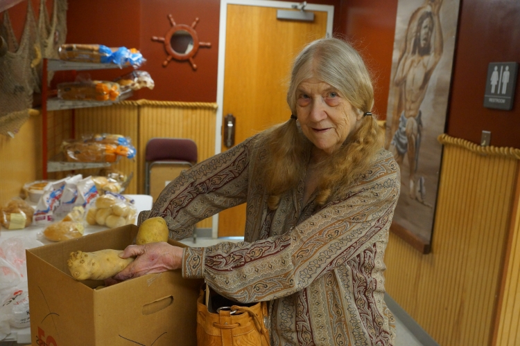 Frances sorting out the fresh locally grown produce